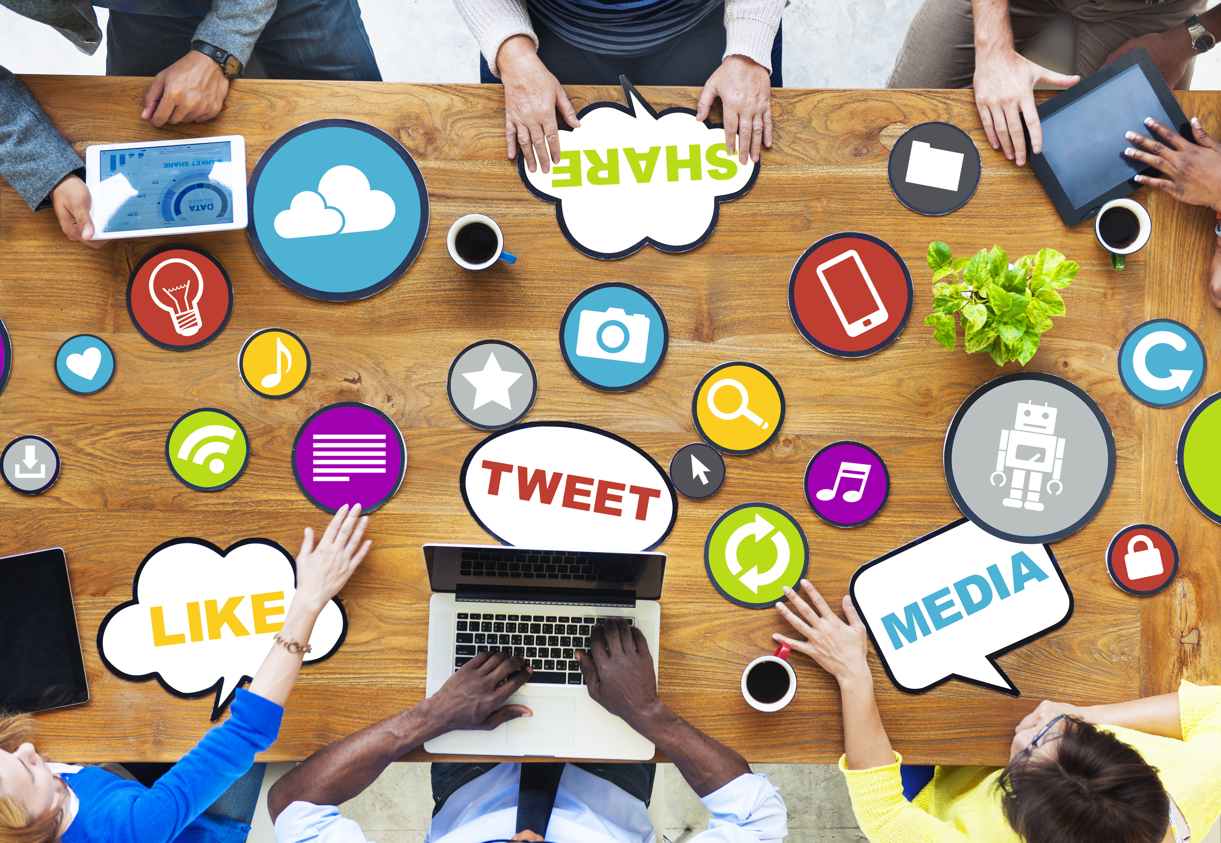 table filled with electronics for social media buying habits